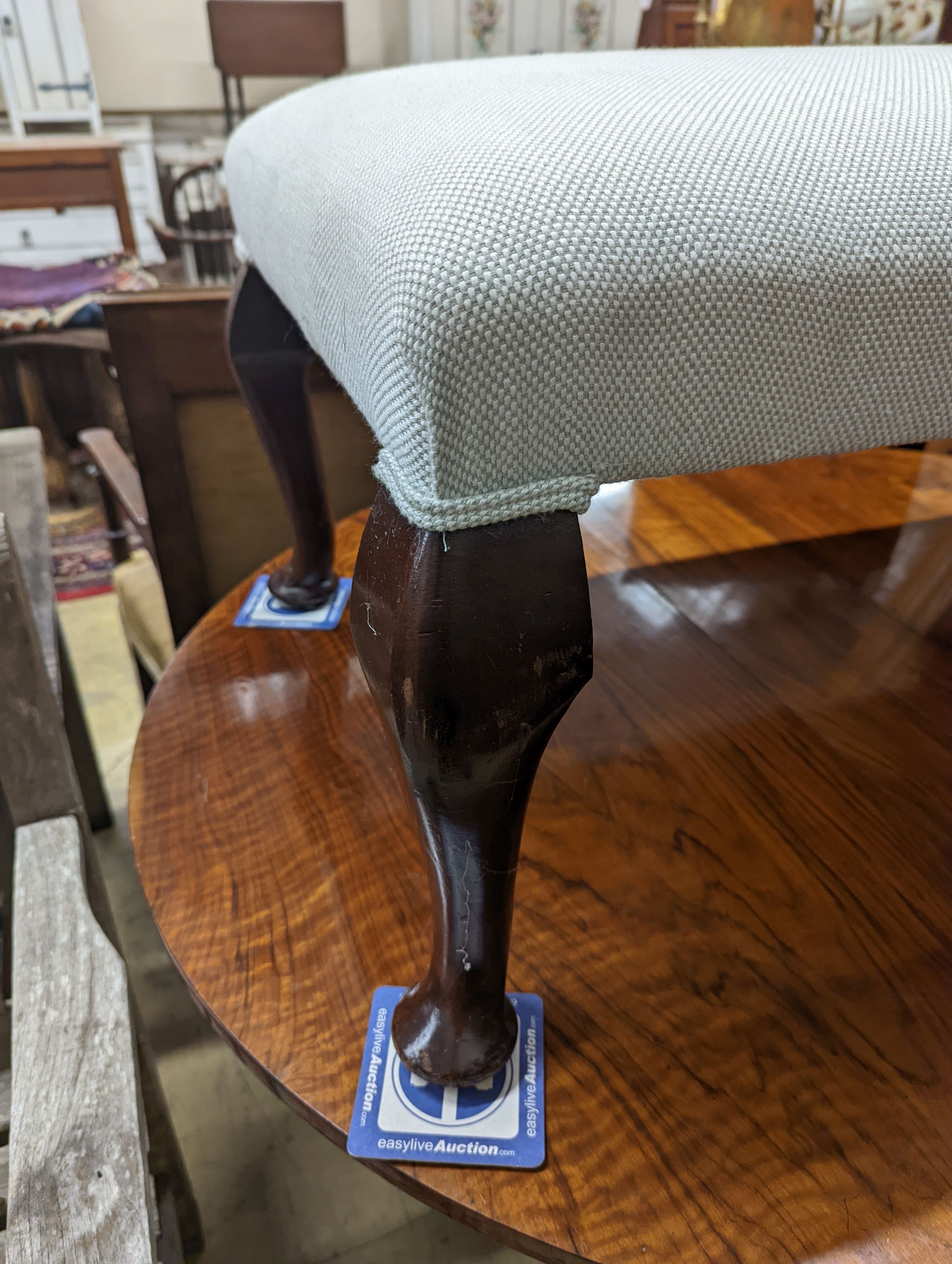 An early 20th century rectangular upholstered dressing stool, length 94cm, depth 54cm, height 42cm